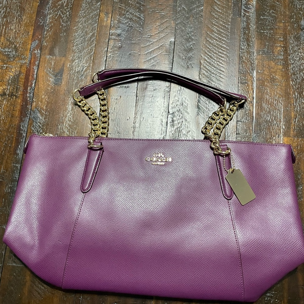 Like new Coach leather purse in wine color.